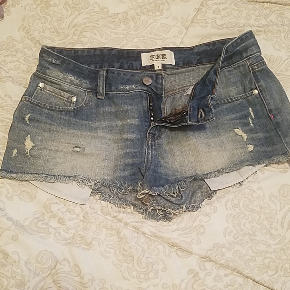 Pink distressed denim shorts